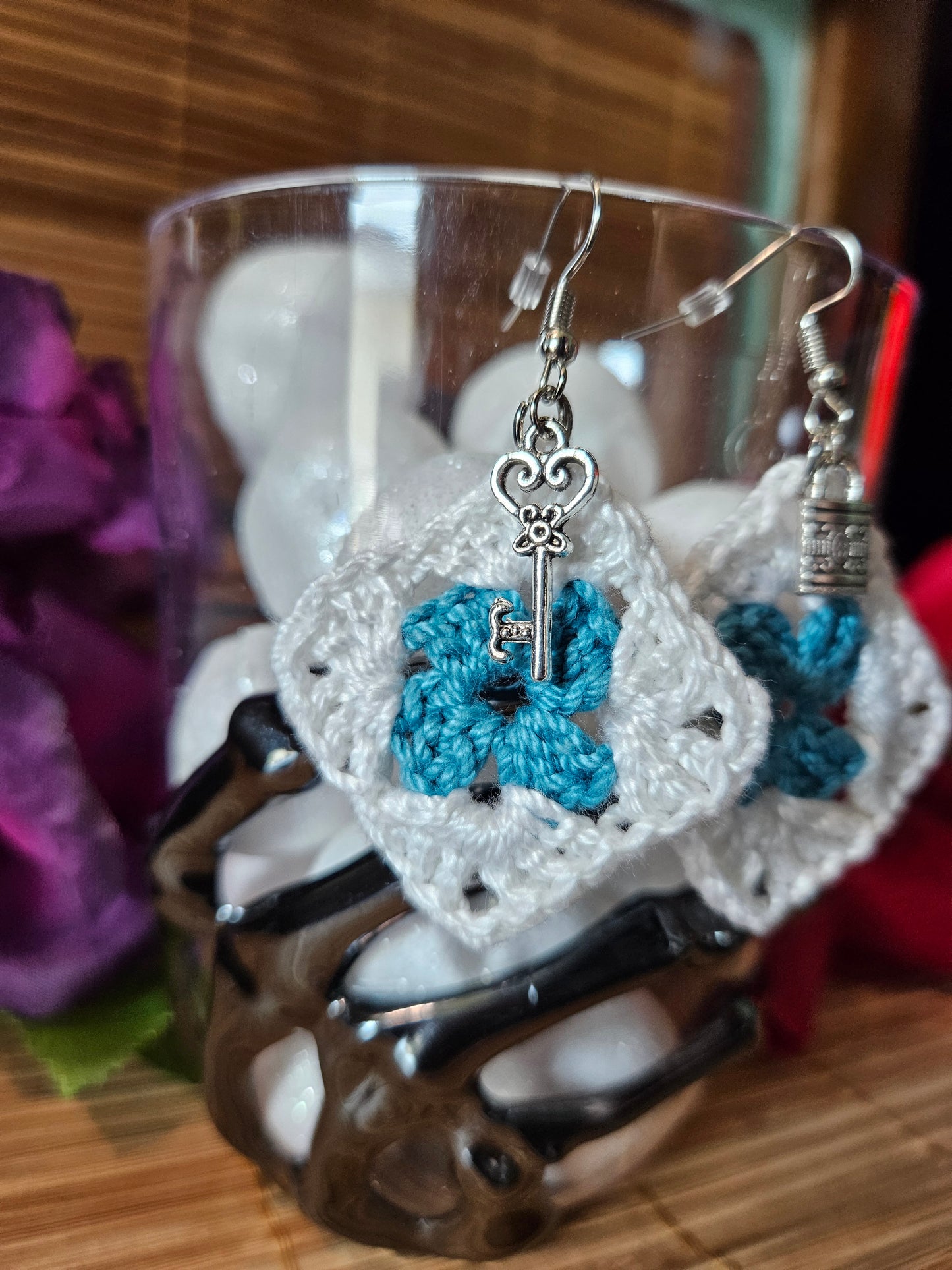 Dangle earring, crochet granny square, White and light blue with metal charms of a lock and key.